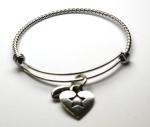 Product Description: The DSNetwork heart on this one-of-a-kind charm represents our loved ones with Down syndrome, who spread so much kindness for all to embrace.A classic bracelet you can buy for yourself or as a gift.</br></br>Stainless steel</br>Recycled hand cast pewter heart charm</br>Adjustable,One size fits most</br>.60" (15 mm) standard charm</br></br>Online orders can be picked up from our office in Tempe - 1445 E Guadalupe Rd, Ste 103, Tempe, AZ 85283 (FREE).*Otherwise, the cost to mail your braceletis$8.</br>*If picking up in the office please call or text 480-759-9150 to make arrangements.</br> DSNetwork Charm Bracelet